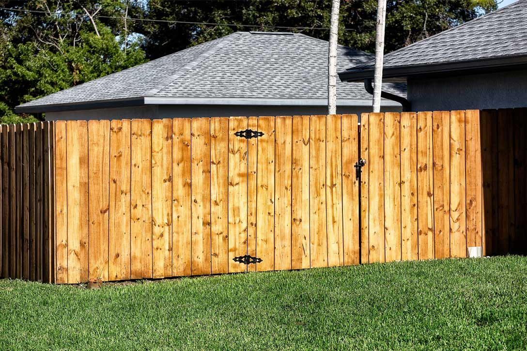 Board-on-board privacy fence with overlapping wood boards